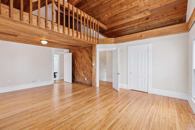 518 32nd St, Minneapolis, MN 55408 - unfurnished living room featuring light wood-style floors, vaulted ceiling, and wooden ceiling