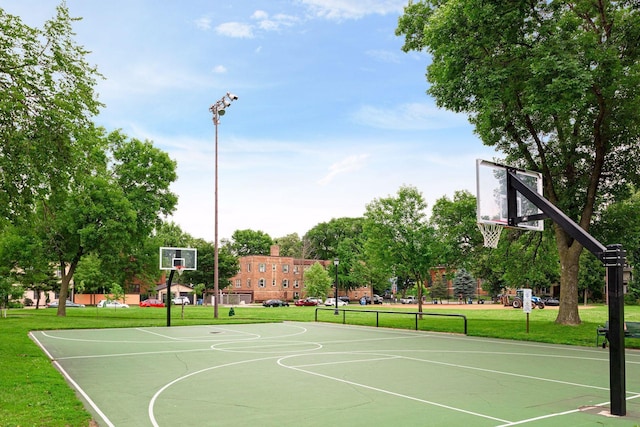 518 32nd St, Minneapolis, MN 55408 - view of sport court with a lawn and community basketball court