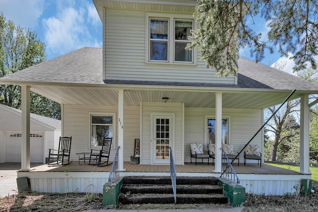 view of front of property featuring a porch and a shingled roof