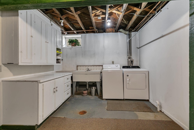 laundry area with washer and clothes dryer and cabinet space