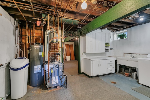 basement with water heater, a water softener system, a heating unit, a sink, and washer / dryer