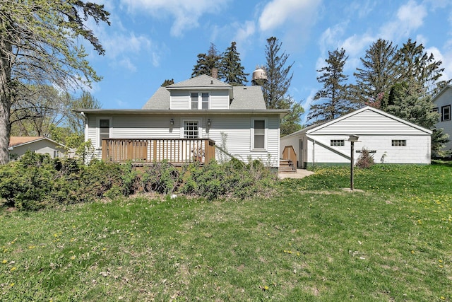 back of property featuring a wooden deck and a yard