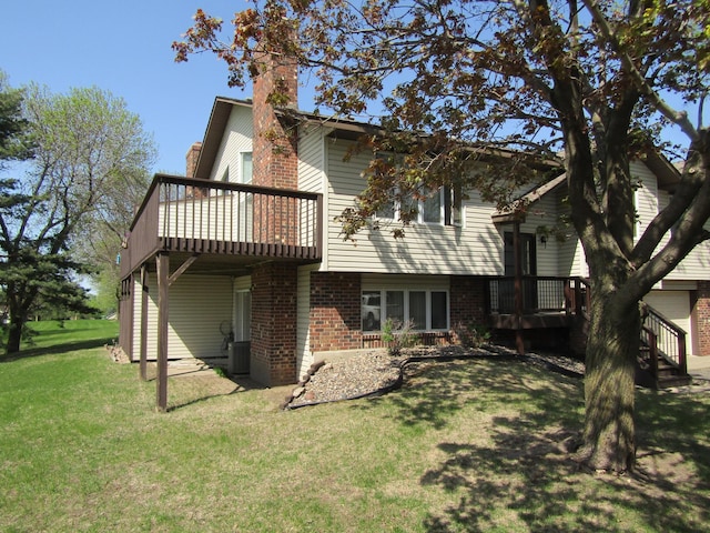 13622 Knox Dr, Burnsville, MN 55337 - rear view of property featuring a deck, a chimney, brick siding, and a lawn