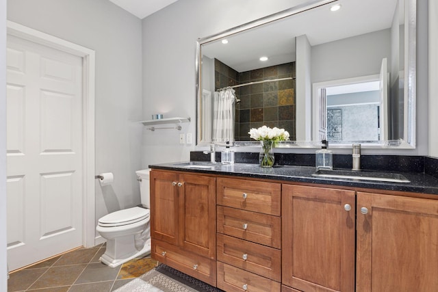 500 Grant St Unit 2509, Minneapolis, MN 55404 - bathroom featuring tile patterned floors, a tile shower, toilet, double vanity, and recessed lighting