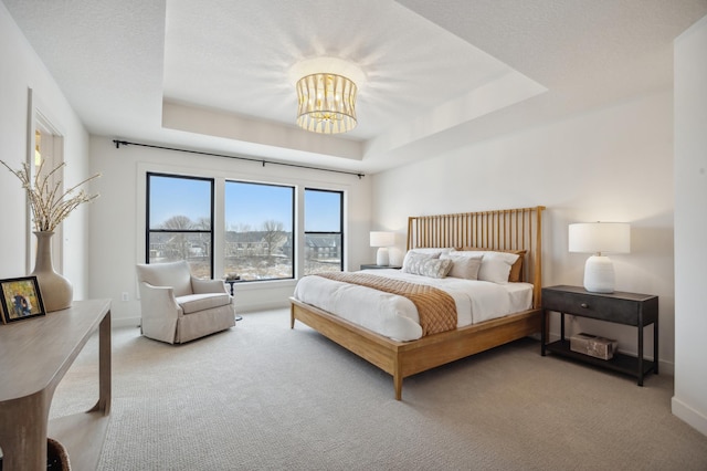10382 Peony Ln N, Maple Grove, MN 55311 - bedroom featuring carpet flooring, a raised ceiling, a chandelier, and baseboards