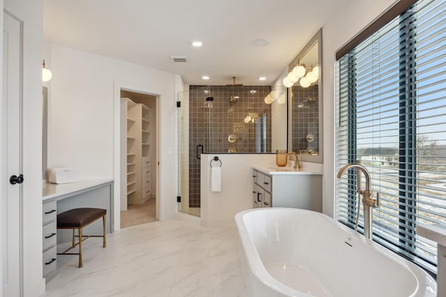 10382 Peony Ln N, Maple Grove, MN 55311 - full bath featuring healthy amount of natural light, a stall shower, vanity, a soaking tub, and recessed lighting