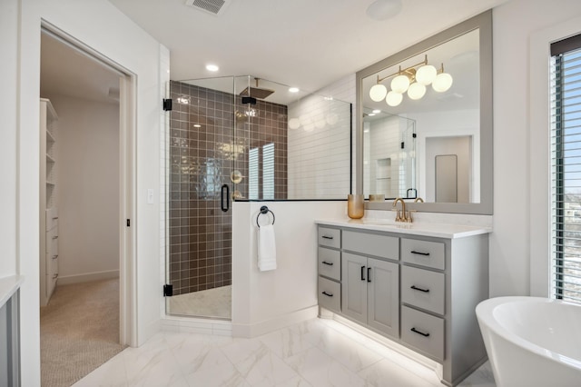 10382 Peony Ln N, Maple Grove, MN 55311 - bathroom featuring a shower stall, vanity, baseboards, a freestanding bath, and recessed lighting