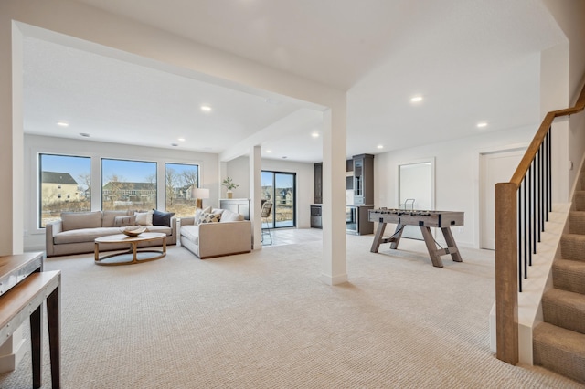 10382 Peony Ln N, Maple Grove, MN 55311 - living area featuring light colored carpet, stairs, and recessed lighting