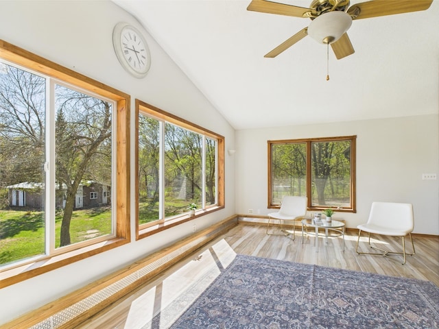 unfurnished sunroom featuring lofted ceiling