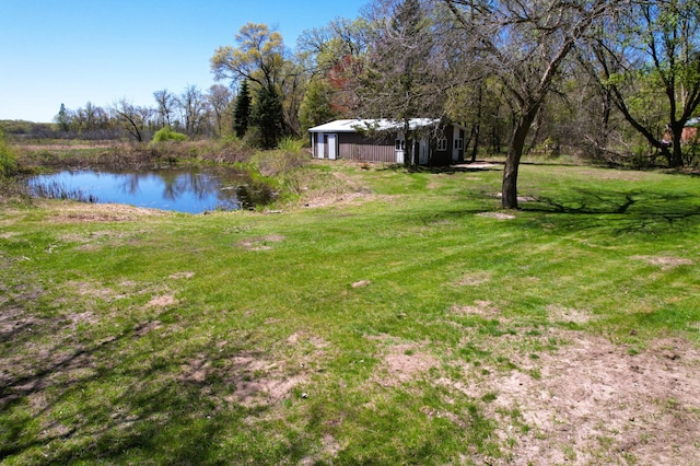 view of grassy yard with a water view