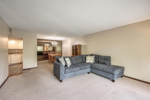 2465 Londin Ln E Unit 212, Maplewood, MN 55119 - living room with carpet flooring, a chandelier, a textured ceiling, and baseboards