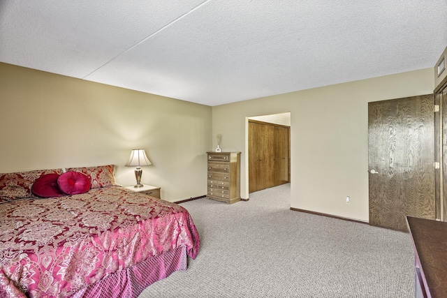2465 Londin Ln E Unit 212, Maplewood, MN 55119 - carpeted bedroom featuring baseboards and a textured ceiling