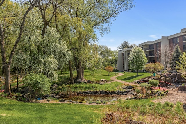 2465 Londin Ln E Unit 212, Maplewood, MN 55119 - view of community featuring a lawn