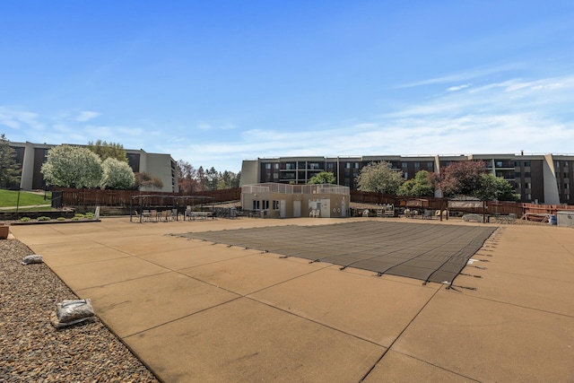 2465 Londin Ln E Unit 212, Maplewood, MN 55119 - view of pool with a patio area and fence
