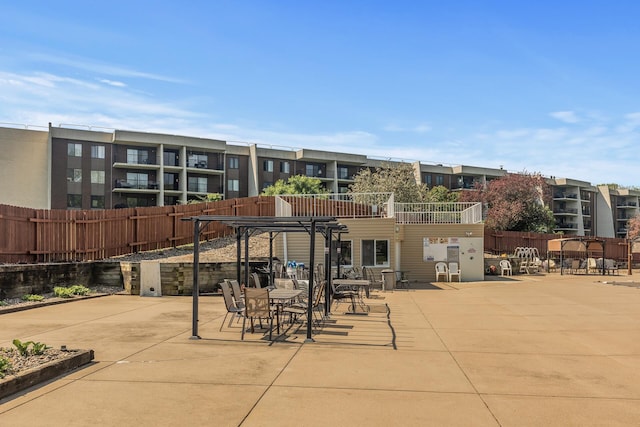 2465 Londin Ln E Unit 212, Maplewood, MN 55119 - view of patio / terrace featuring a pergola and fence