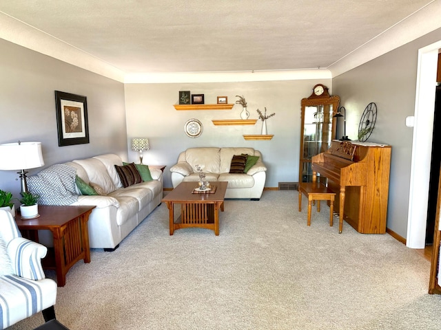living area featuring carpet floors and baseboards