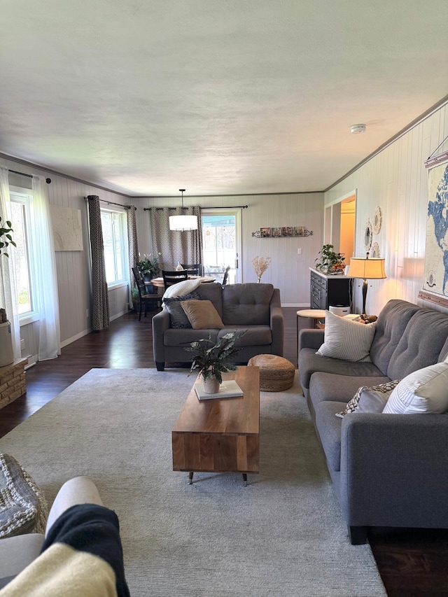 living room with wood finished floors and baseboards