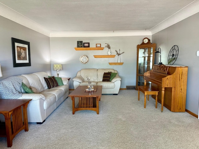 living room featuring carpet floors, baseboards, and ornamental molding