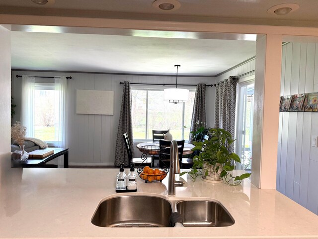 kitchen featuring a sink and light countertops