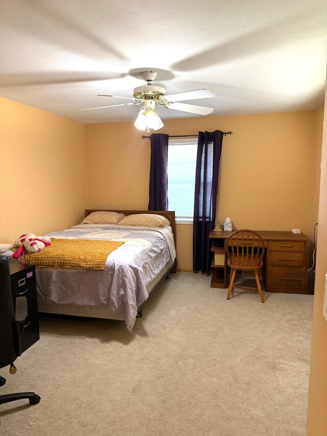 bedroom featuring carpet and a ceiling fan