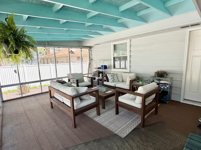 sunroom / solarium featuring an outdoor hangout area and beam ceiling