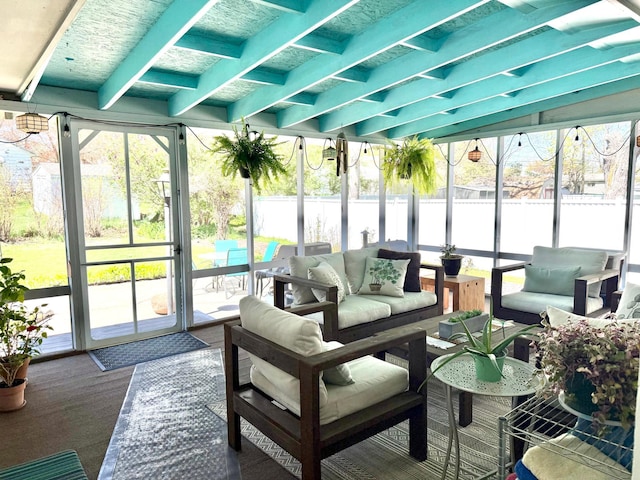 sunroom featuring an outdoor hangout area and healthy amount of natural light