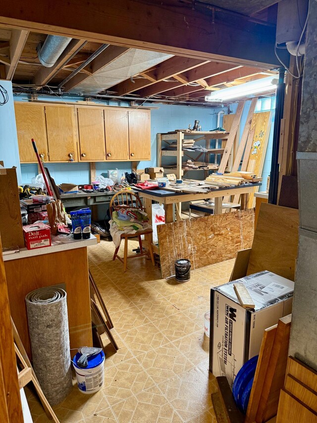 unfinished basement with a workshop area