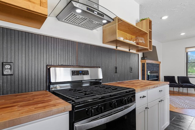 20355 Cedar Lake Trl, Shieldsville Twp, MN 55052 - kitchen featuring wooden counters, stainless steel range with gas stovetop, exhaust hood, white cabinetry, and recessed lighting