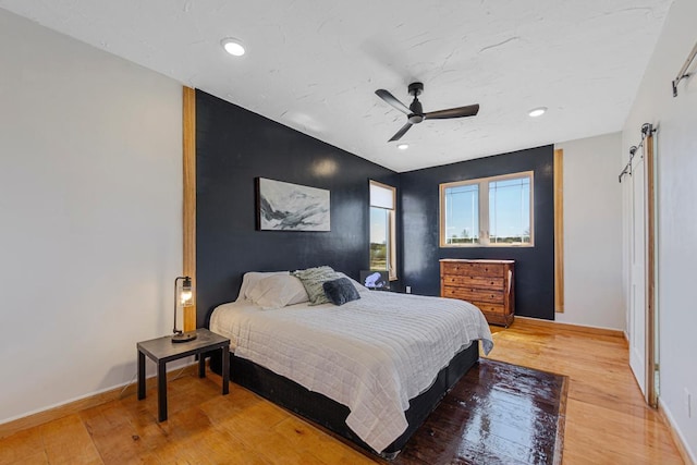 20355 Cedar Lake Trl, Shieldsville Twp, MN 55052 - bedroom featuring light wood-type flooring, baseboards, recessed lighting, and ceiling fan