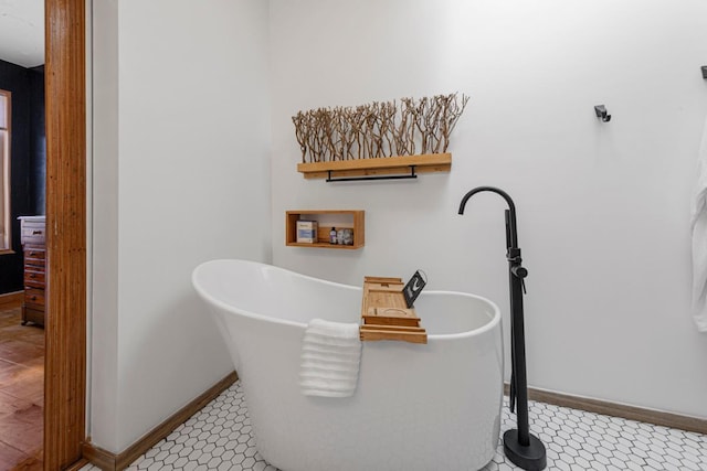 20355 Cedar Lake Trl, Shieldsville Twp, MN 55052 - bathroom with a freestanding tub and baseboards