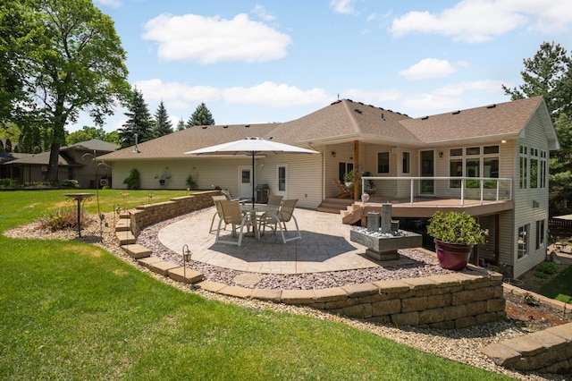 6209 Heather Pl NE, Fridley, MN 55432 - rear view of property featuring a patio area, a shingled roof, a lawn, and a wooden deck