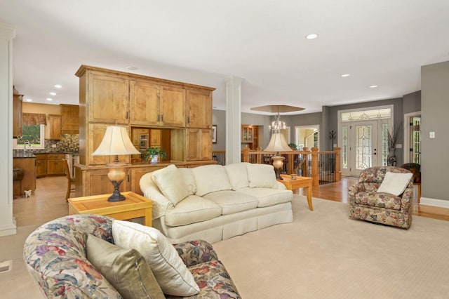 6209 Heather Pl NE, Fridley, MN 55432 - living area with recessed lighting, healthy amount of natural light, a chandelier, and ornate columns