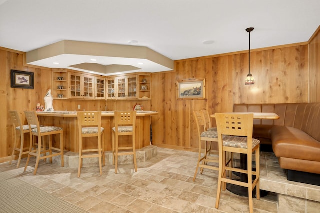6209 Heather Pl NE, Fridley, MN 55432 - indoor bar featuring wooden walls, stone finish floors, hanging light fixtures, and recessed lighting