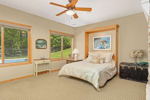 6209 Heather Pl NE, Fridley, MN 55432 - bedroom with carpet, baseboards, and a ceiling fan