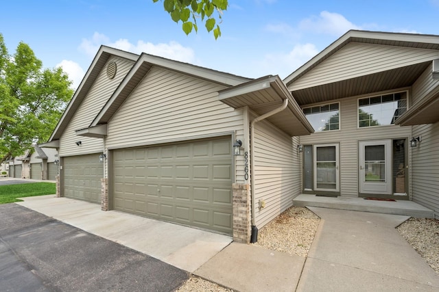 8260 Parkington Ave NE, Otsego, MN 55330 - view of front of home featuring a garage and driveway