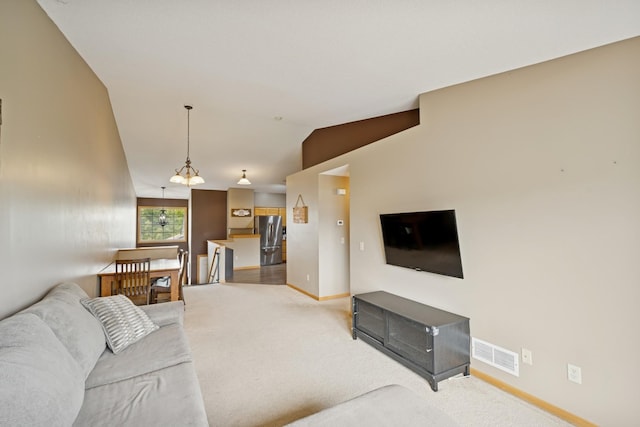 8260 Parkington Ave NE, Otsego, MN 55330 - living room with baseboards, light carpet, and vaulted ceiling