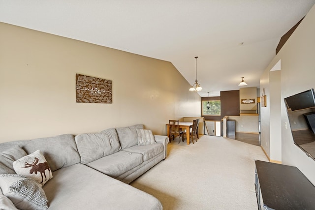 8260 Parkington Ave NE, Otsego, MN 55330 - carpeted living room with vaulted ceiling and a chandelier
