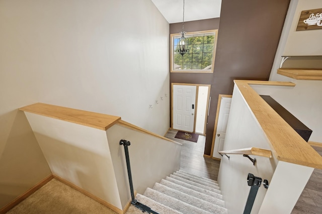 8260 Parkington Ave NE, Otsego, MN 55330 - stairs with baseboards, a chandelier, and a high ceiling
