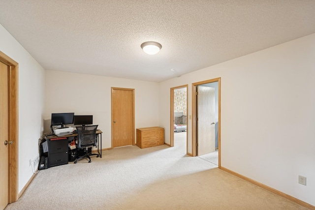 8260 Parkington Ave NE, Otsego, MN 55330 - home office featuring light colored carpet, a textured ceiling, and baseboards