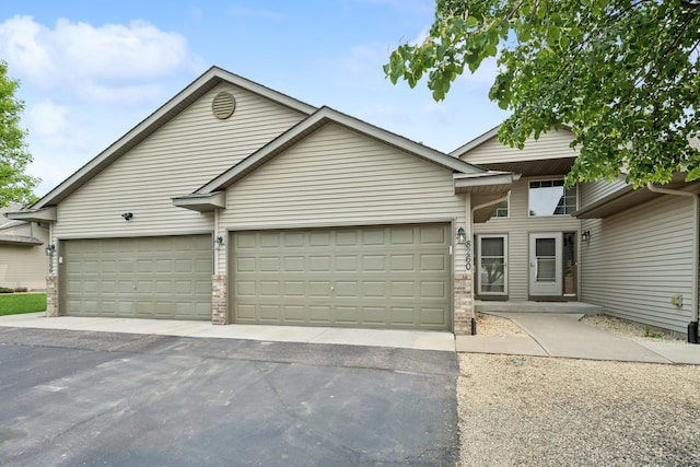 8260 Parkington Ave NE, Otsego, MN 55330 - view of front of house with a garage and asphalt driveway
