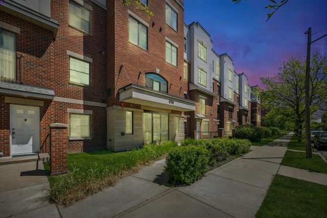 property at dusk with a residential view
