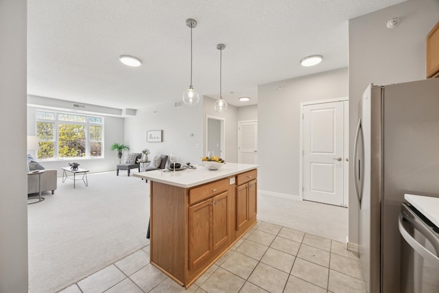 kitchen featuring light colored carpet, open floor plan, light tile patterned floors, and light countertops