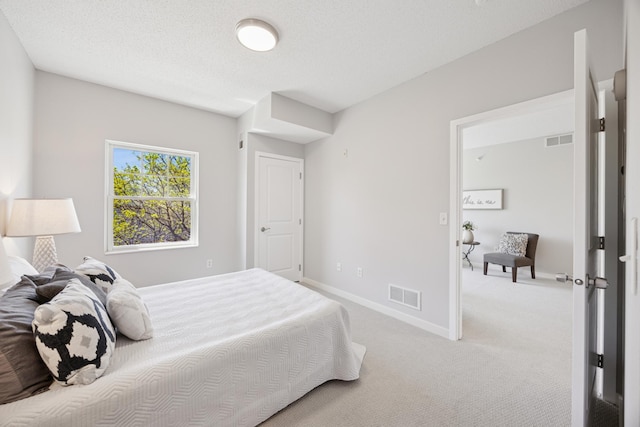 bedroom featuring light carpet and baseboards
