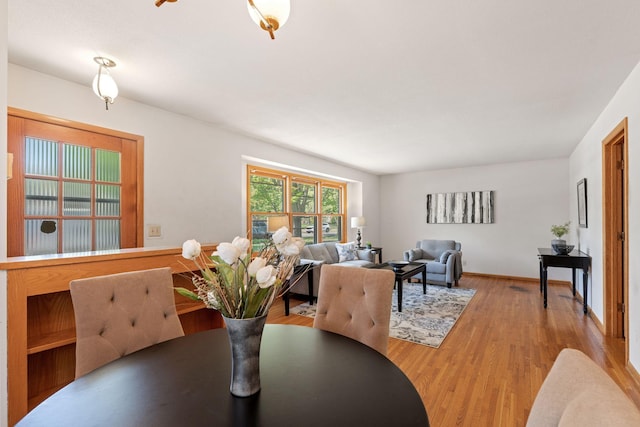 dining room with wood finished floors and baseboards