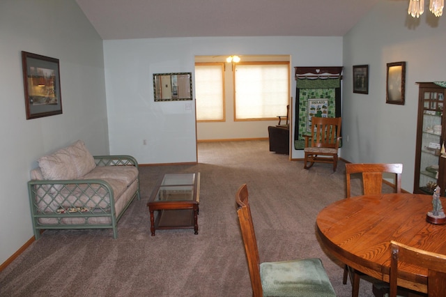 living area with lofted ceiling, carpet, and baseboards