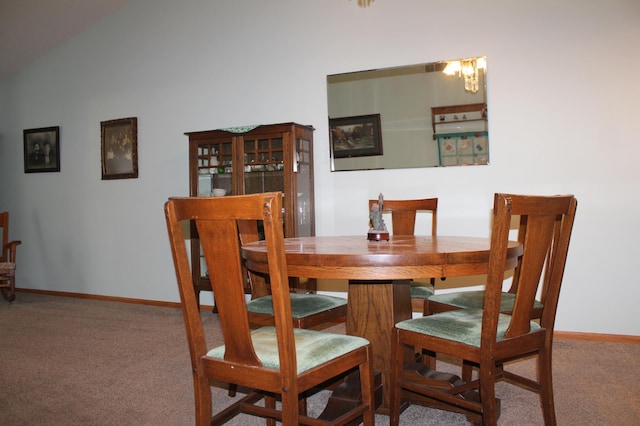 dining room featuring carpet floors and baseboards