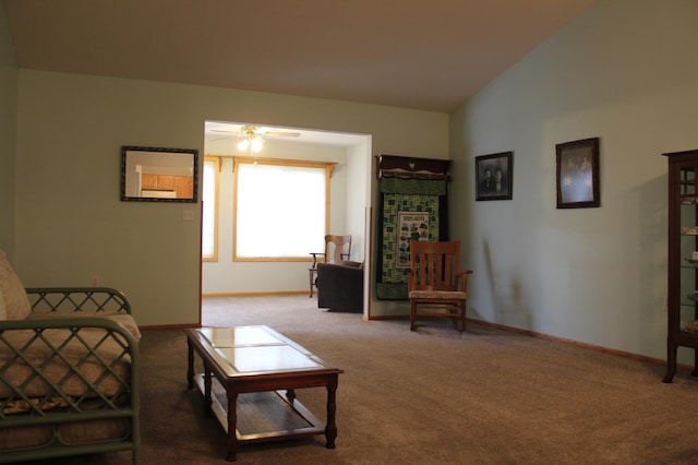 sitting room featuring carpet floors, baseboards, and ceiling fan