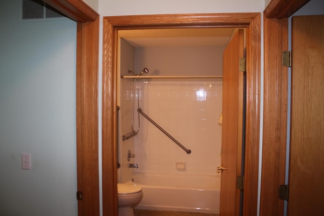full bathroom featuring toilet and shower / washtub combination