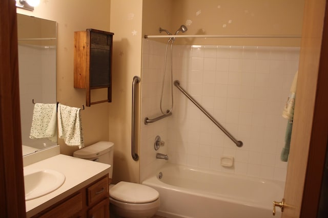 bathroom with bathtub / shower combination, toilet, and vanity