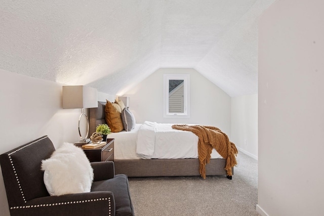 1650 Sherburne Ave, Saint Paul, MN 55104 - carpeted bedroom featuring a textured ceiling, lofted ceiling, and baseboards